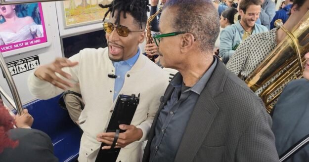 Jon Batiste says he barely spoke as a child. Now, he’s making “social music.”