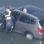 High tides break records, closing several roadways, flooding neighborhoods on both coasts