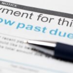 Squeezed by inflation, more Americans are falling behind on debt payments