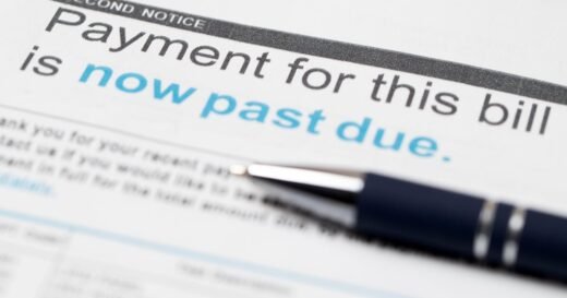 Squeezed by inflation, more Americans are falling behind on debt payments
